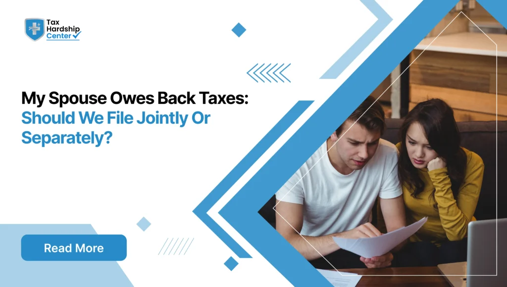 Couple reviewing tax documents while considering whether to file taxes jointly or separately